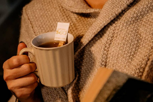 women hold a cup of tea